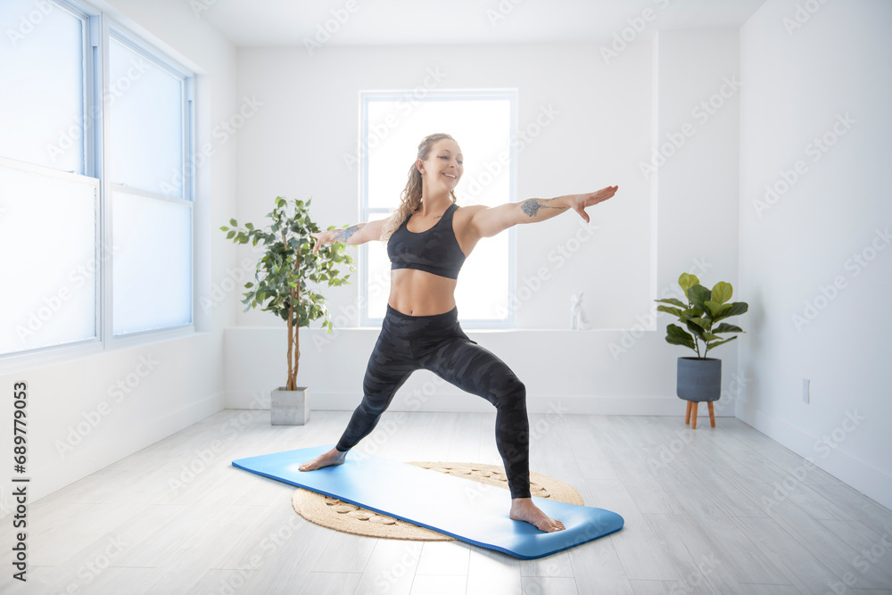 nice woman practicing yoga in job studio nice woman practicing yoga in job studio
