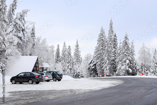 HARKABUZ, POLAND - DECEMBER 03, 2023: The parking lot for passenger cars is completely covered with snow. © agneskantaruk