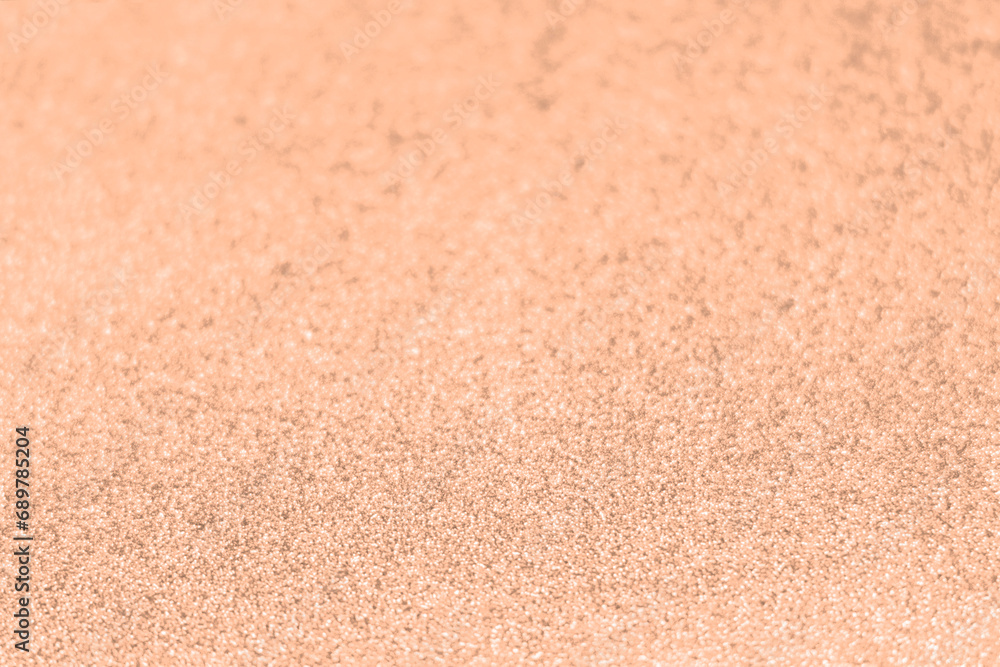 Fototapeta premium Peach fuzz, color of the year 2024, wave shiny glitter paper texture. Shining luxurious fabric. Glimmering golden color, christmas background.