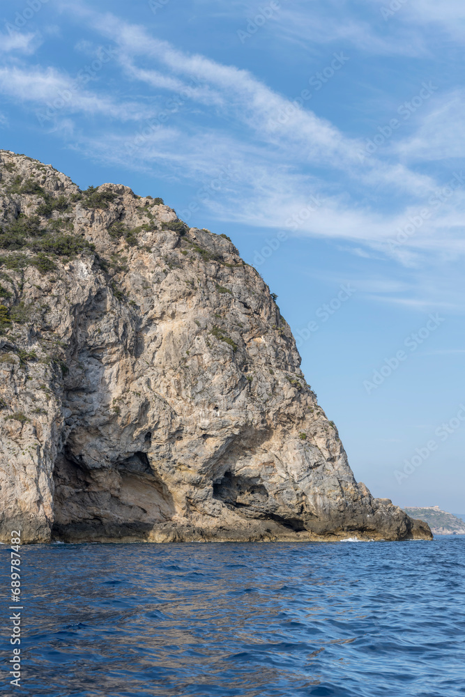 steep worn cliffs of Avoltore cape, Argentario, Italy