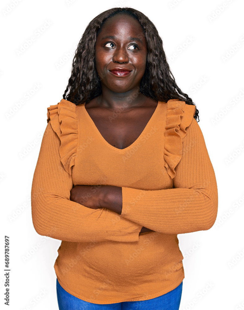 Young african woman wearing casual clothes smiling looking to the side and staring away thinking. Young african woman wearing casual clothes smiling looking to the side and staring away thinking.