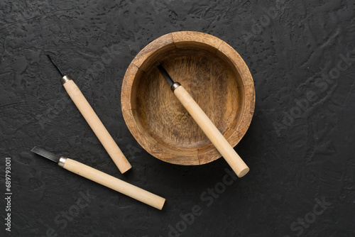 Carpenter tools with wooden objects on concrete background ,top view