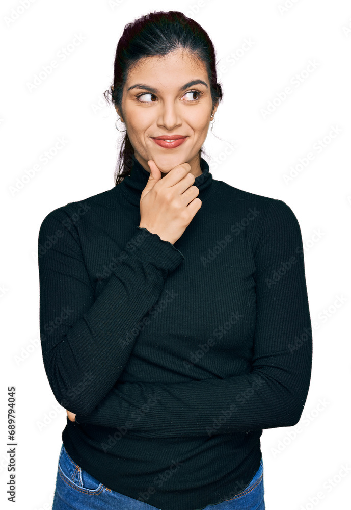 Young hispanic woman wearing casual clothes with hand on chin thinking about question, pensive expression. smiling with thoughtful face. doubt concept. Young hispanic woman wearing casual clothes with hand on chin thinking about question, pensive expression. smiling with thoughtful face. doubt concept.