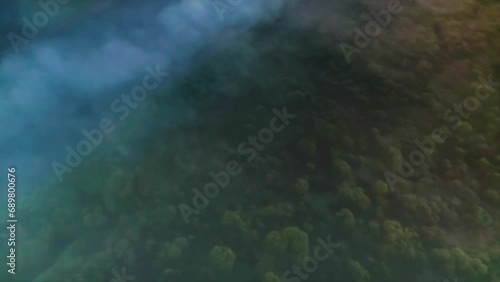 Mystical Early Summer Morning. Dawn Light Dances Through Dense Fog. Aerial Drone Shot photo