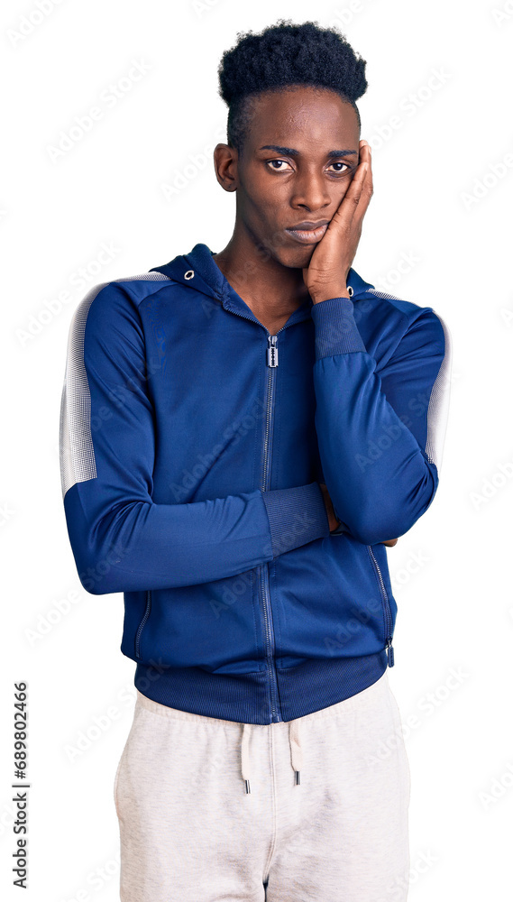 Young african american man wearing sportswear thinking looking tired and bored with depression problems with crossed arms. Young african american man wearing sportswear thinking looking tired and bored with depression problems with crossed arms.