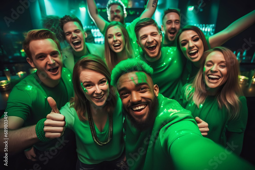 Multiracial friends having fun  wearing green costumes and celebrating St. Patrick s Day in night club party