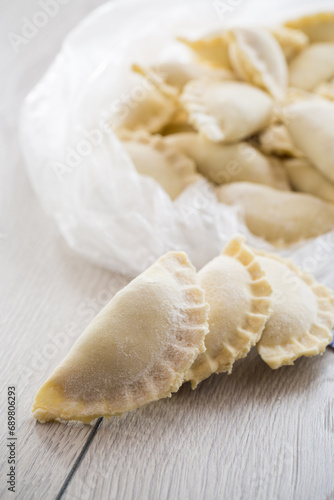 Raw dumplings with filling inside, Ukrainian cuisine.