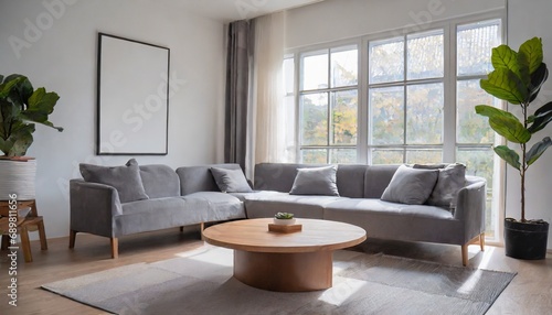 Grey chair and round coffee table near corner sofa against dark grey paneling wall. Scandinavian style home interior design of modern living room