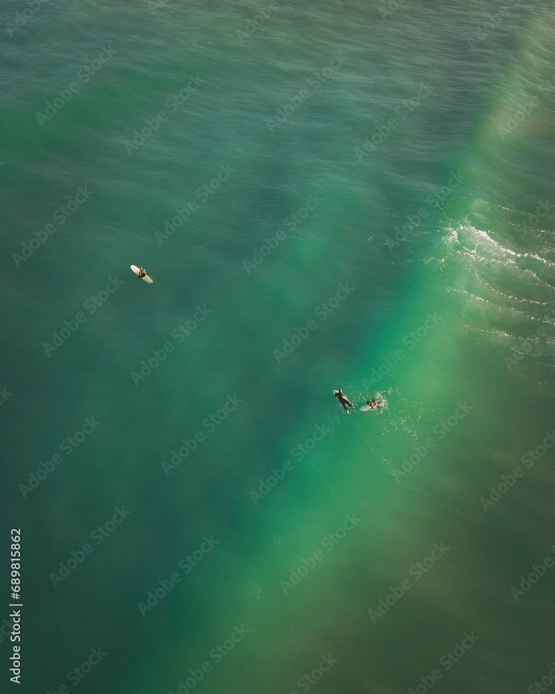 Aerial view of surfers in the morning, Bidart, French Basque Country, France. Aerial view of surfers in the morning, Bidart, French Basque Country, France.