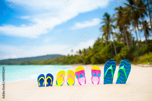 Flip flops on tropical beach. Vacation footwear.