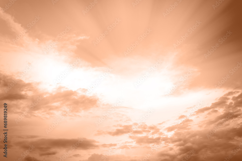 Color 2024 peach fuzz. Color of the Year concept. Designer tinted peach fuzz. Clouds in the sky.blue sky with white clouds and sun. Sunshine clouds sky sky concept during morning background.