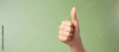 Close up of healthy woman touching her abdomen and showing thumb up sign for good digestive healthy gut probiotics slim fit body and gynecology concept. Copyspace image. Square banner photo