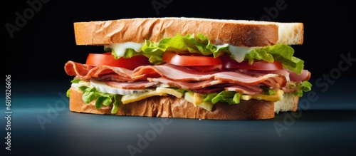 close up of fresh sandwich with ham bacon tomatoes cheese and lettuce. Copyspace image. Square banner. Header for website template