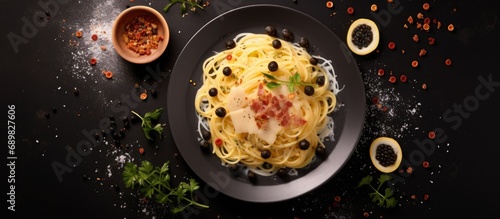 Delicious spaghetti alla carbonara a traditional roman recipe of pasta topped with egg pecorino and black pepper sauce italian food. Copyspace image. Square banner. Header for website template photo
