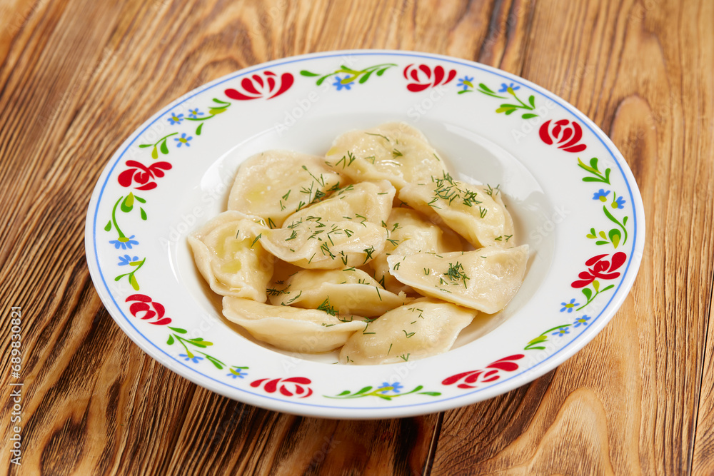 dumplings with meat on the wooden background dumplings with meat on the wooden background