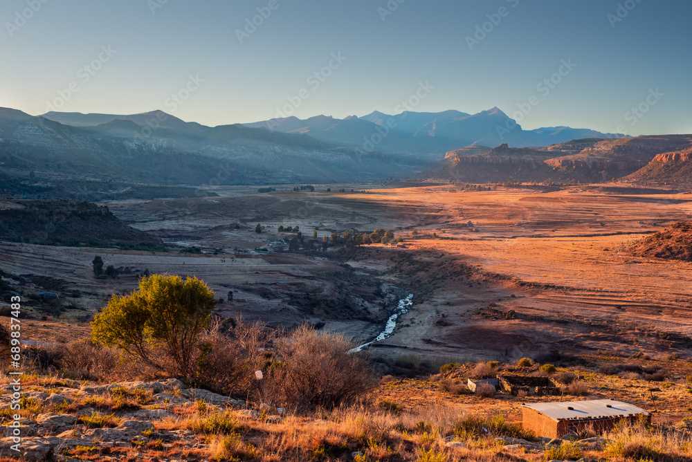 Mountains and valley soaked in golden light, Lesotho