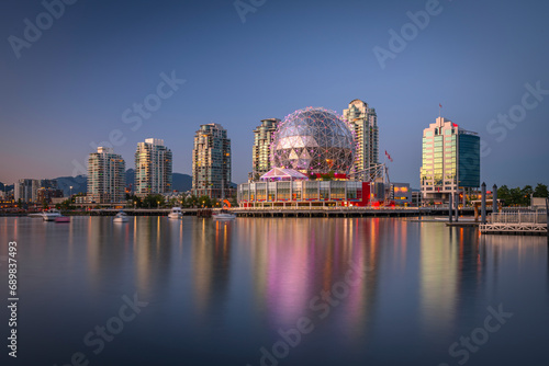 View of Vancouver skyline with modern buildings along the False Creek at sunset, British Columbia, Canada. photo