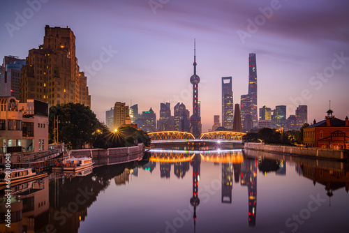 View of Shanghai skyline at night, view of the financial district along the Huangpu River, China. photo