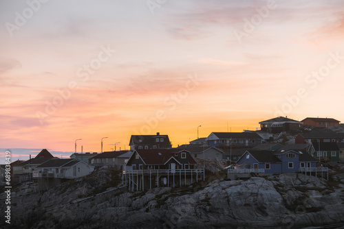 View of houses at a hazy morning at the village of Ilulissat, Greenland.