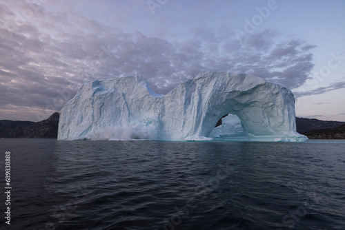 View of collapsing crushing iceberg at Ilulissat, Greenland. photo