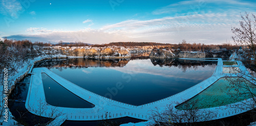 Krakow  Poland - November 30  2023  Swimming and paddling pools on a Zakrzowek lake with steep cliffs in place of former flooded limestone quarry. Panoramic view at winter time