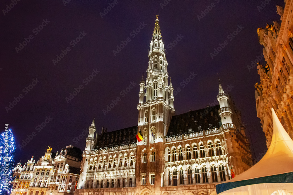Fantastic  illuminated Town hall on the city square encircled by buildings dating back to 14th century of Brussels