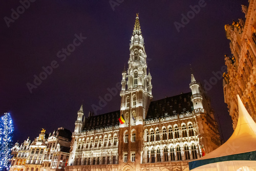 Fantastic illuminated Town hall on the city square encircled by buildings dating back to 14th century of Brussels