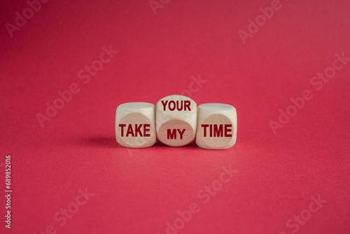 Concept red words Take your or my time on wooden cubes. Beautiful red background. Business and Take your or my time concept. Copy space.