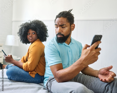 phone woman couple conflict problem man girlfriend mobile boyfriend husband young wife smartphone angry unhappy quarrel mobile phone girl cheating communication photo