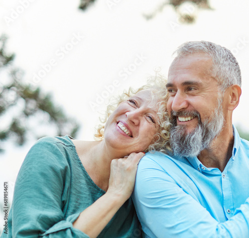 woman man couple happy together hug bonding mature mid middle age aged park outdoor talking leisure fun smiling love old nature wife happiness lifestyle people adult caucasian husband togetherness