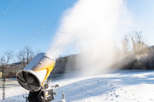  cannon is producing artificial snow for ski slopes in Cunardo sky resort, province of Varese, Lombardy, Italy photo