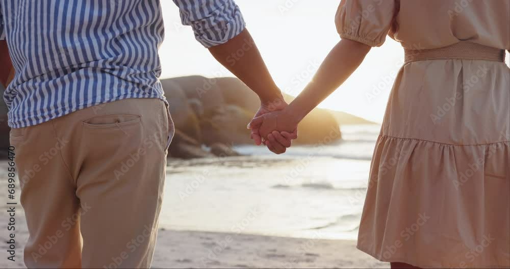 Beach, holding hands or couple on date on a marriage anniversary celebration on holiday vacation. Love, woman or romantic man bonding in nature or relationship for care, trust or support together Beach, holding hands or couple on date on a marriage anniversary celebration on holiday vacation. Love, woman or romantic man bonding in nature or relationship for care, trust or support together