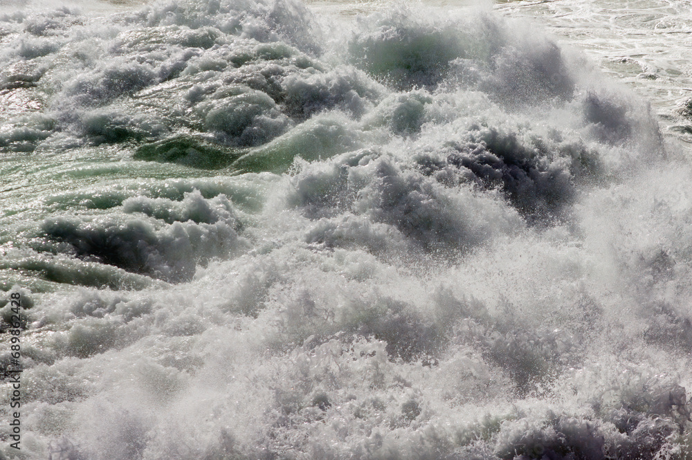 big giant waves breaking on a stormy day in atlantic sea ocean
