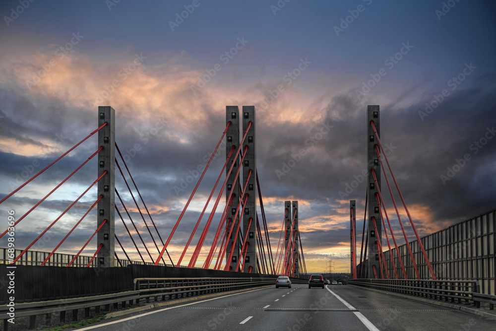 Fototapeta premium Cable-stayed bridge and card on the highway