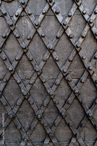 Old wrought iron door with spikes