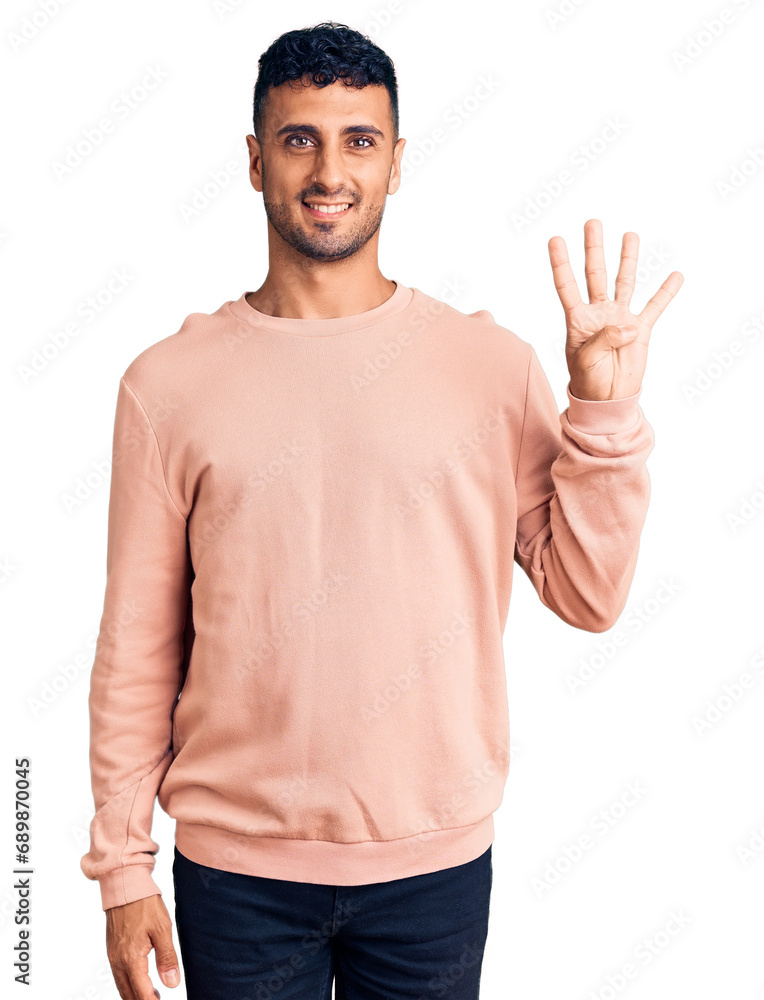 Naklejka premium Young hispanic man wearing casual clothes showing and pointing up with fingers number four while smiling confident and happy.