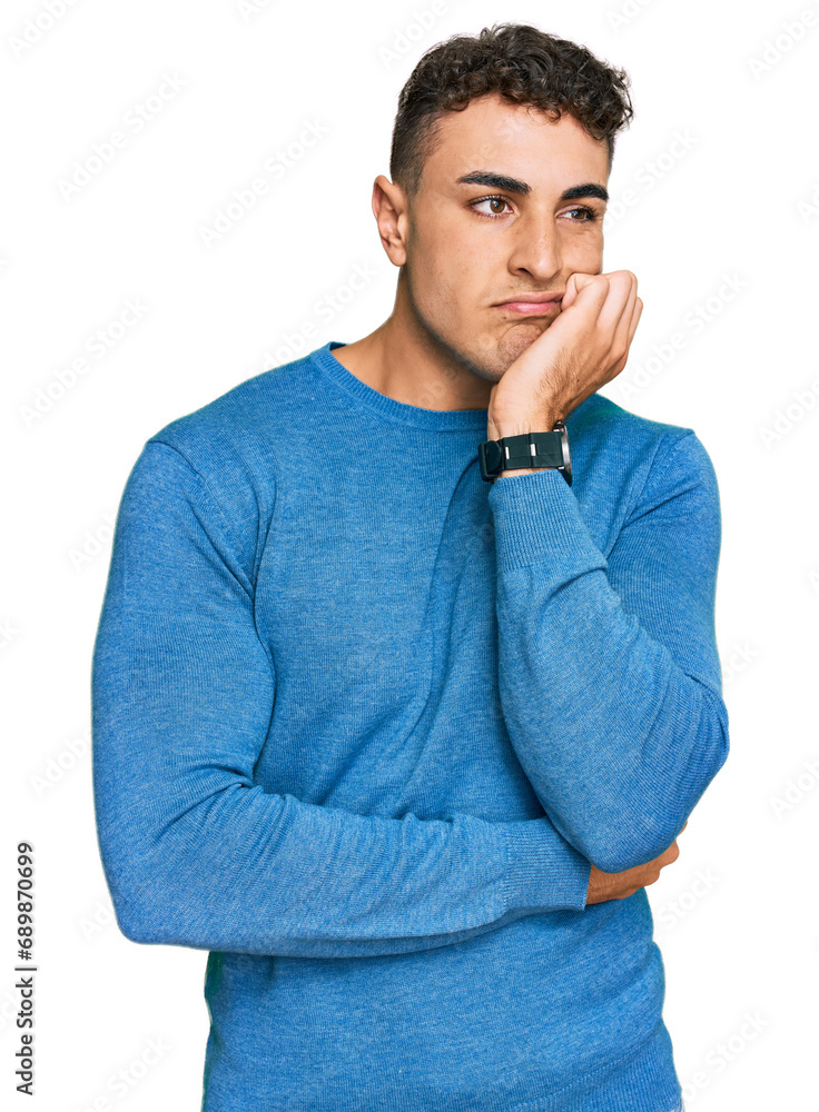Hispanic young man wearing casual clothes thinking looking tired and bored with depression problems with crossed arms. Hispanic young man wearing casual clothes thinking looking tired and bored with depression problems with crossed arms.