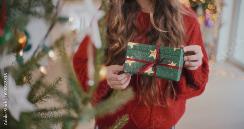 Woman Holding Christmas Gift Enjoying Christmas Holidays