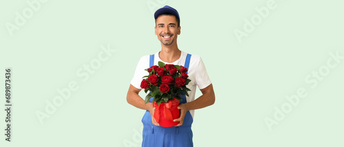 Delivery man holding bouque...