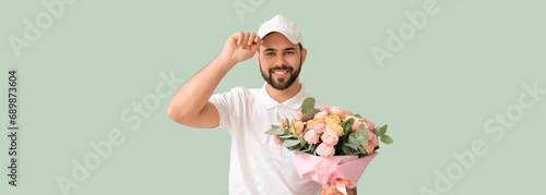 Delivery man holding bouque...