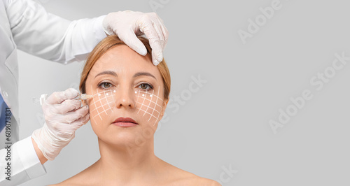 Mature woman receiving fill...