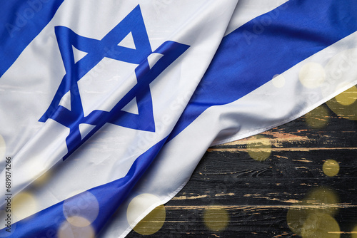 Flag of Israel on black wooden background photo