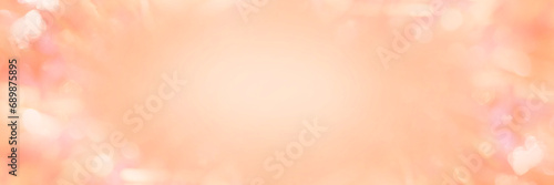 Blurred background of peach fuzz Christmas tinsel