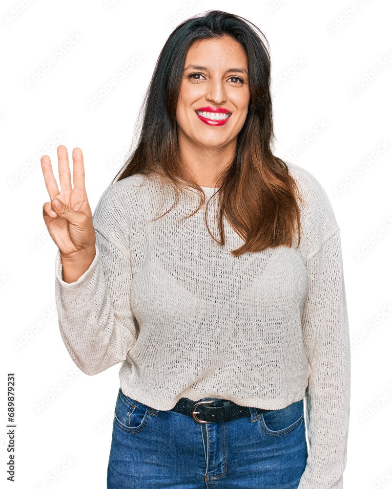 Beautiful hispanic woman wearing casual sweater showing and pointing up with fingers number three while smiling confident and happy. Beautiful hispanic woman wearing casual sweater showing and pointing up with fingers number three while smiling confident and happy.