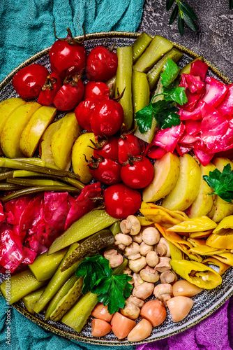 Assorted pickled vegetables on a large platter. top veiw