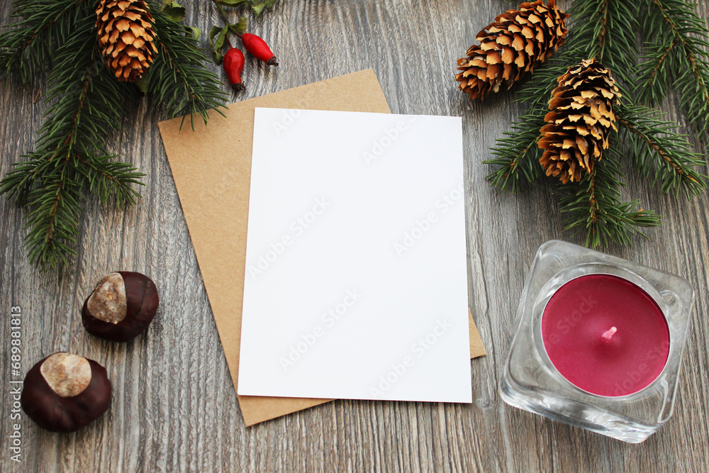 Christmas card greeting and invitation postcard with envelope mockup, vertical flat composition with xmas decoration and wooden background mock up template. Christmas card greeting and invitation postcard with envelope mockup, vertical flat composition with xmas decoration and wooden background mock up template.