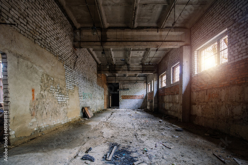 Old broken empty abandoned industrial building interior © Mulderphoto