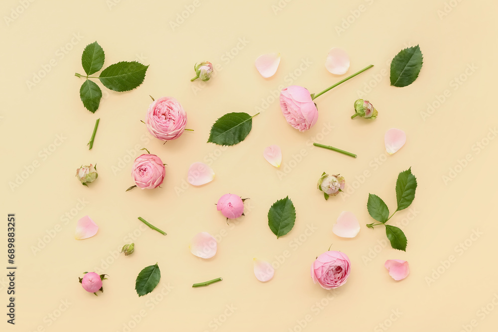 Beautiful pink roses with leaves and petals on yellow background Beautiful pink roses with leaves and petals on yellow background