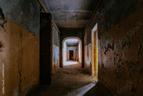 Dark vaulted corridor in old abandoned building © Mulderphoto