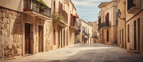 Deserted streets in Mallorca with aged structures. photo